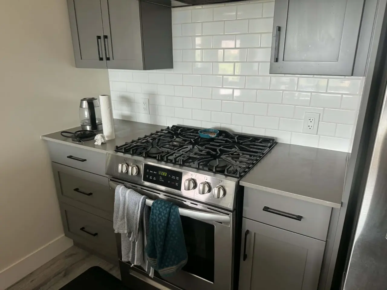 Clean kitchen with tile backsplash and clear counters in a Kamloops home